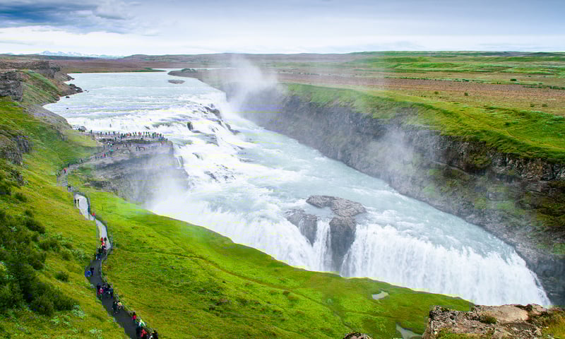 Feel the thundering power of the double-tiered Gullfoss Waterfall.