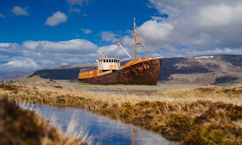 Gardar BA64, Iceland’s oldest steel ship, rusts on the shore, Patreksfjordur, Iceland (itin 1 & 3).