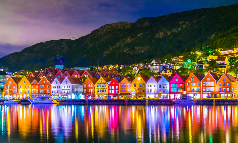 Watch for the colourful lights of Bergen's Bryggen wharf, Itinerary 2.