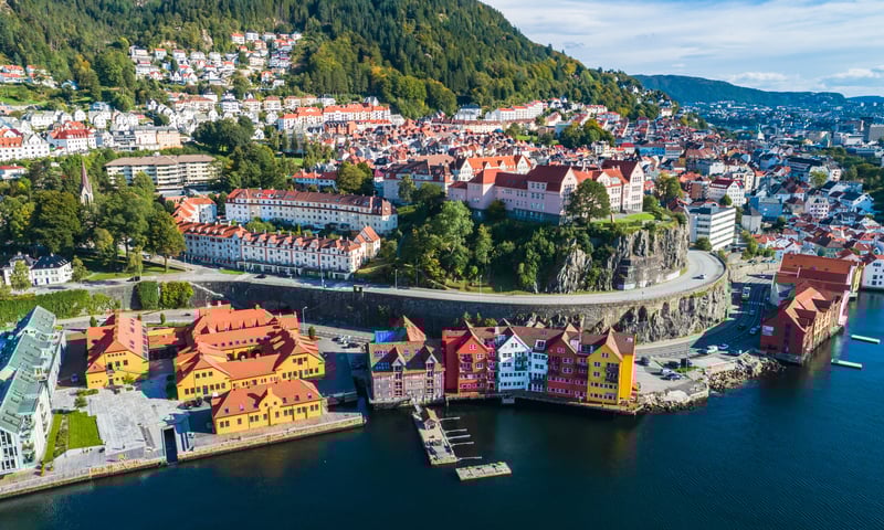 Surrounded by fjords and mountains, Bergen invites visitors to its old wharf and hiking trails.