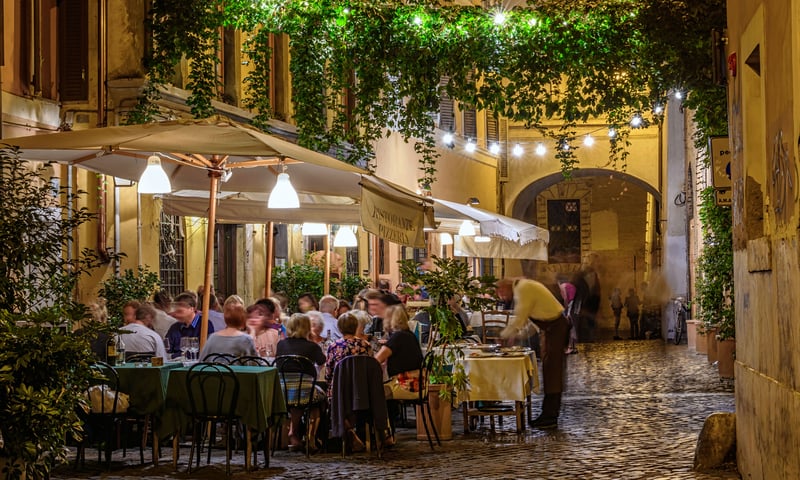 Treat yourself to an optional three-course dinner in Rome's Trastevere district.