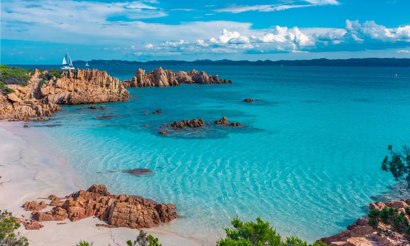 Join a full-day boat excursion to the Emerald Coast’s hidden coves and lush green islands.
