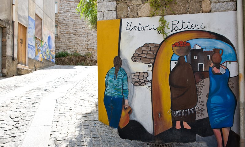 Explore the in the colourful street murals of Orgosolo.