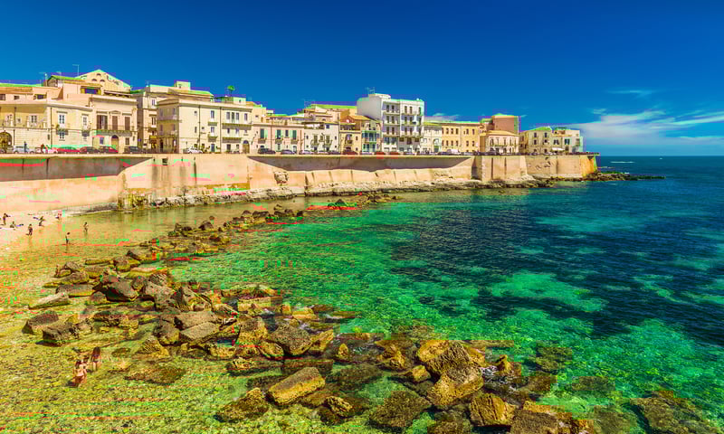 Join a guided tour around Syracuse including Ortigia Island's Castello Maniace and Temple of Apollo.