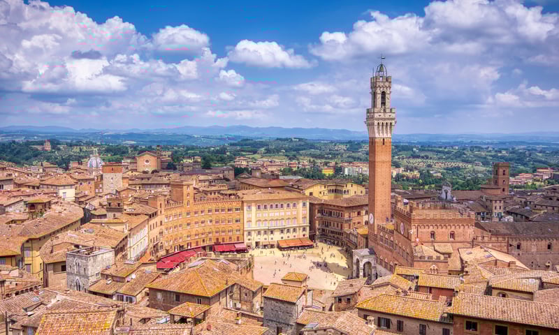 Piazza del Campo with The Torre Del Mangia tower in Siena.