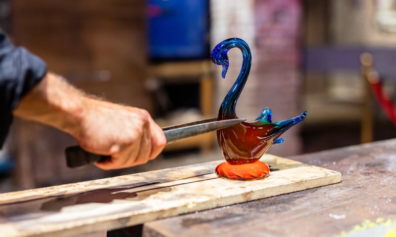 Book an optional activity to see glass blowing on Murano Island near Venice, Italy, charges apply.