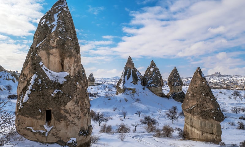 Cappadocia's rocks in winter create a breathtaking winter wonderland.