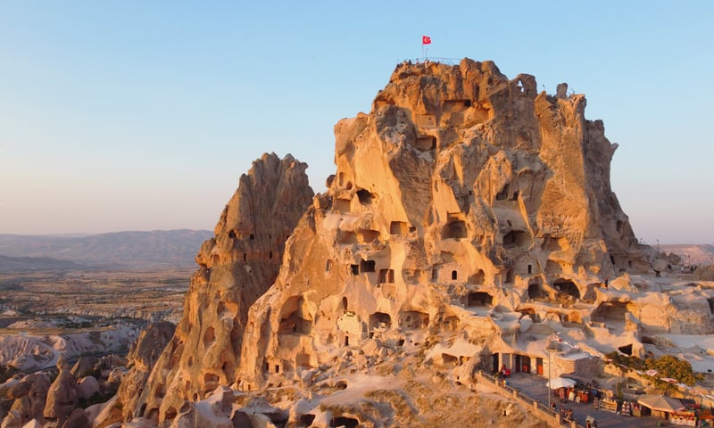 Visit Uchisar Castle in Cappadocia, Türkiye (Itinerary 2).