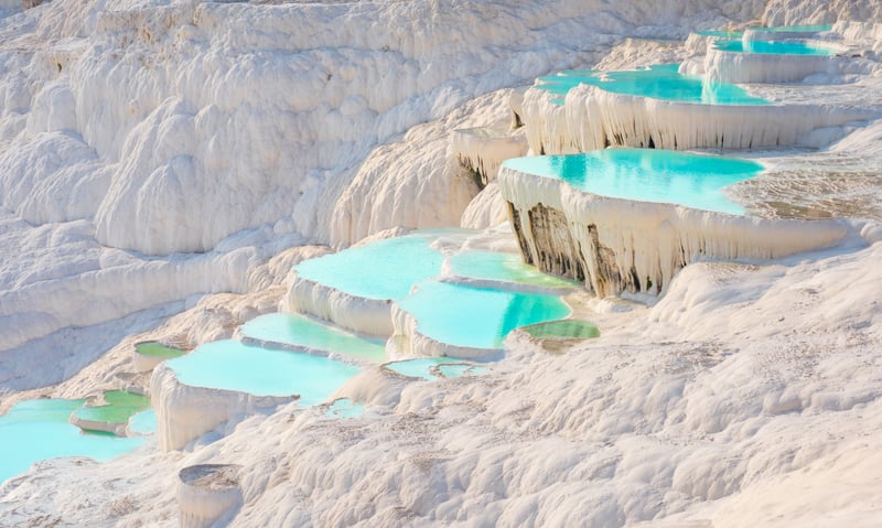 Enjoy a tour to the calcium terraces of Pamukkale, Türkiye.