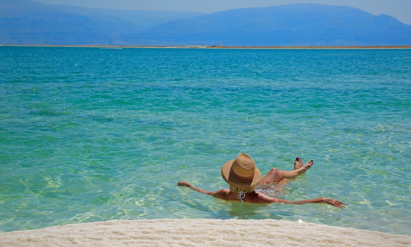 Float in the ultrasaline waters of the Dead Sea, Jordan.