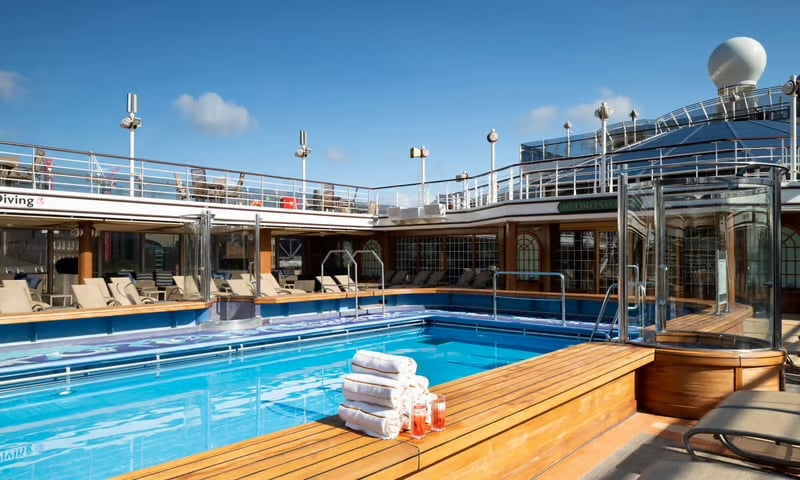 Take a dip in a refreshing pool and join in the fun of endless entertainment aboard Queen Elizabeth.