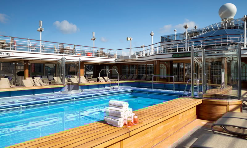 Find your sun lounge and relax poolside on  Cunard's Queen Elizabeth.