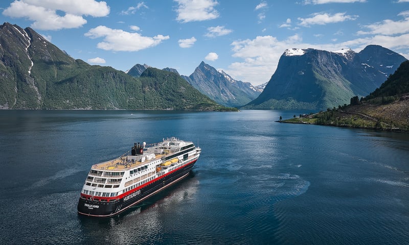 Board a Hurtigruten ship to sail along Norway's coastline.