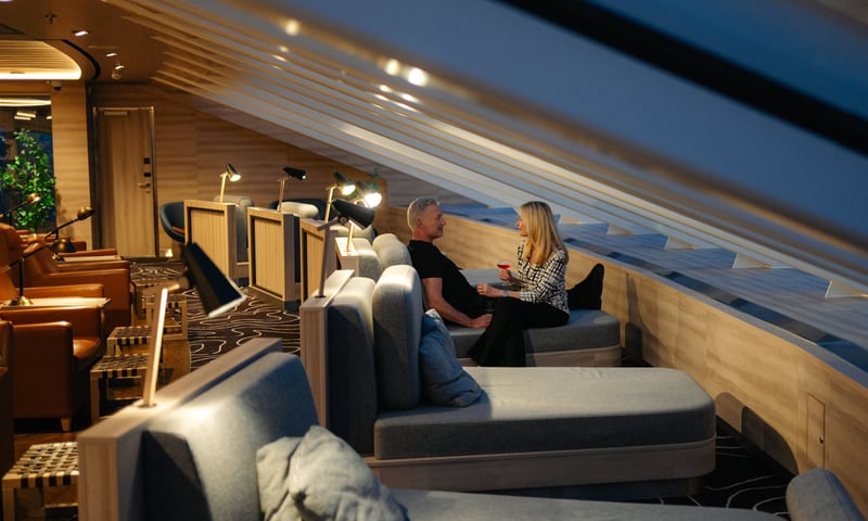 While at sea, relax and unwind in the Explorer's Lounge.