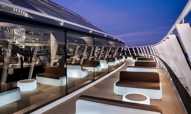 Unwind on an outdoor deck lounge aboard MSC World Asia. (Itinerary 1 & 2)