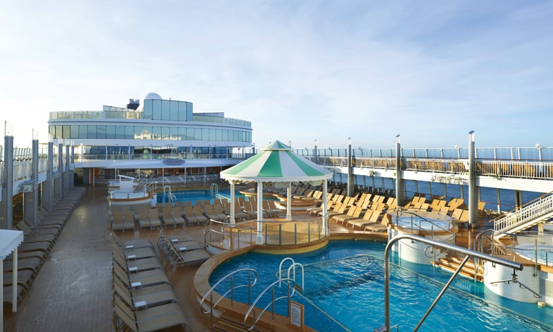 Pull up a deckchair and soak up the Mediterranean sun take a dip in the onboard pool, Norwegian Gem.