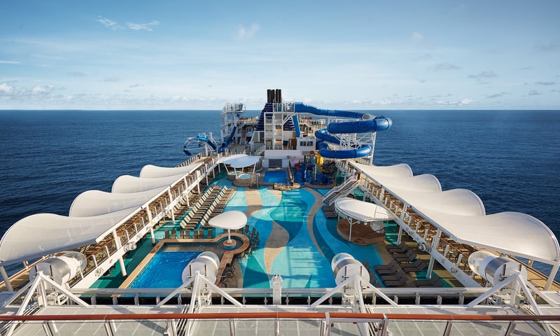 Relax in the Top Deck at NCL's Norwegian's Joy with 2 pools, 2 hot tubs and a bar.