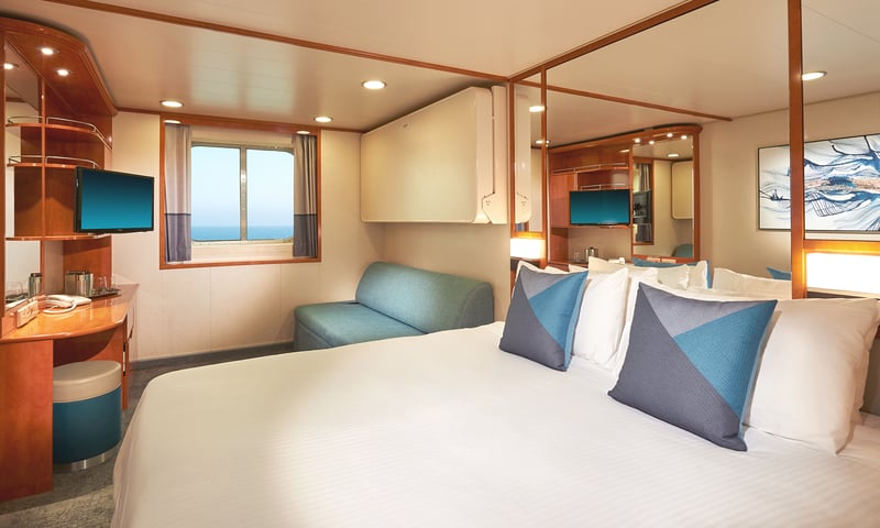 Wake to perfect sea views in an upgraded Oceanview cabin aboard Norwegian Sun, charges apply.
