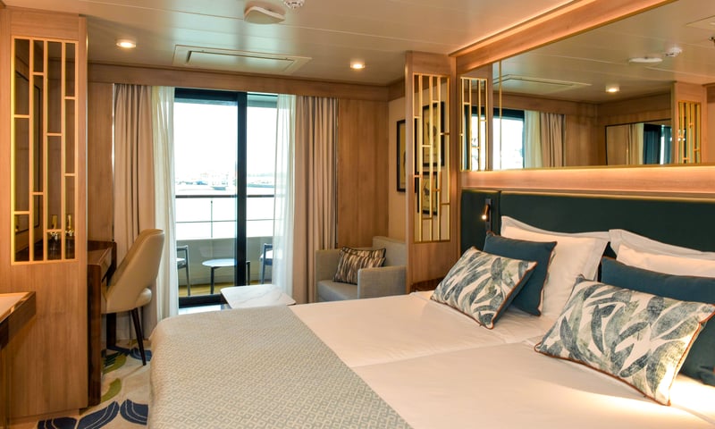 Upgrade to a Veranda Suite onboard Quark Expeditions' World Voyager.