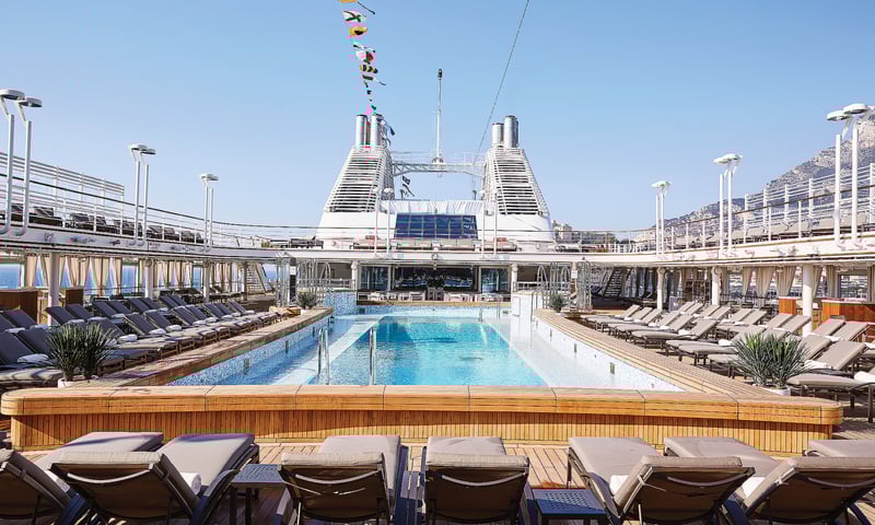 Enjoy sea days soaking up the sun by the pool.