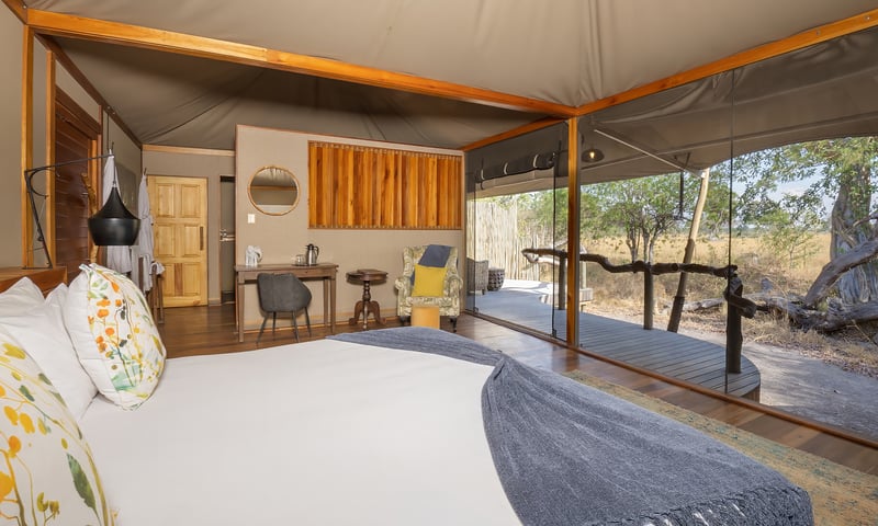 Watch for wildlife from your bedroom in the heart of the Okavango Delta, Kadizora Camp, or similar.
