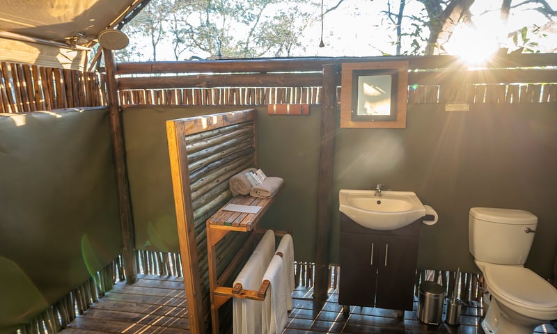 Enjoy a shower with wilderness views from your private indoor/outdoor en-suite.
