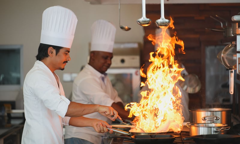 Chefs at work at one of six restaurants at  Ifuru Island Resort, Maldives.