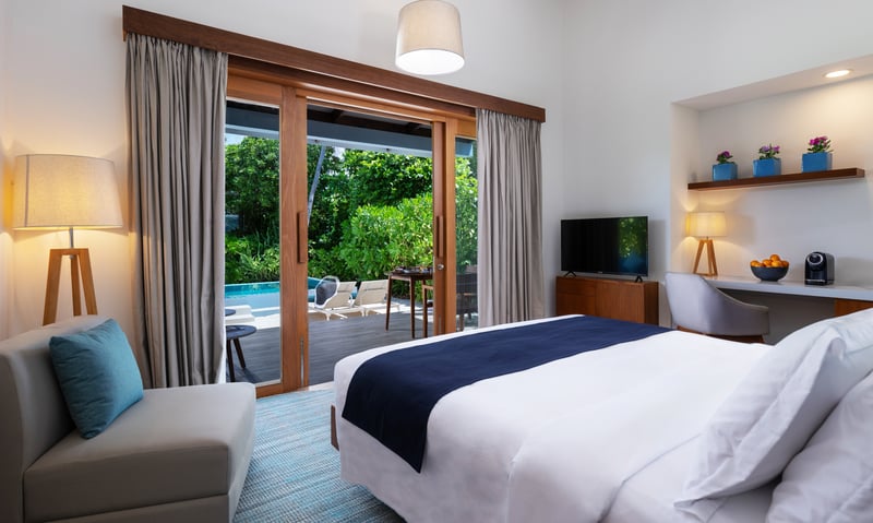 Upgrade to a Sunset Beach Villa with Pool at Ifuru Island Resort, Maldives.