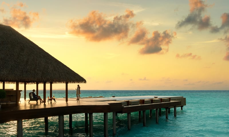 Relax by the infinity pool at sunset.