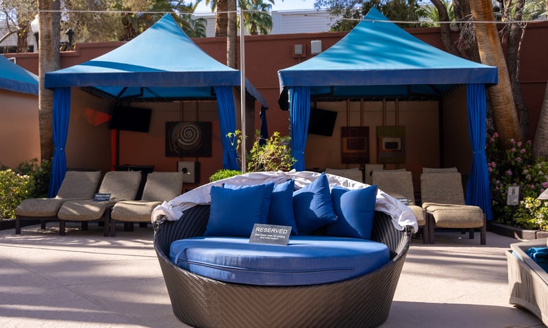 Choose to reserve a day bed by the pool at Treasure Island. (Additional charges required)