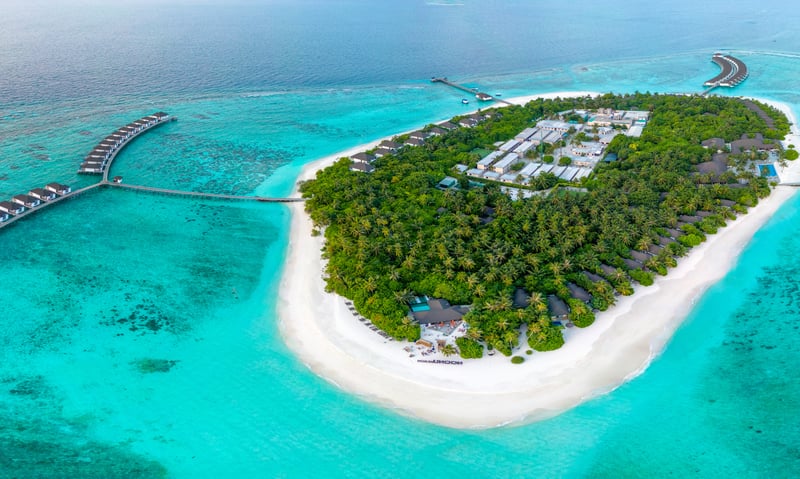 Stay at the Robinson Noonu Resort.