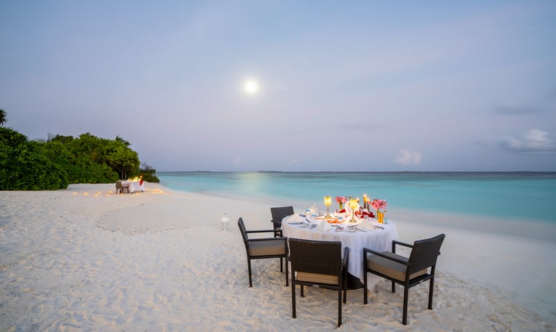 Enjoy a dinner on the beach at the Robinson Noonu Resort (charges apply).