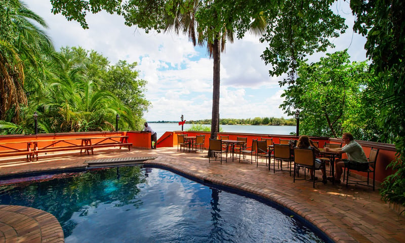 Stay at Victoria Falls Waterfront Lodge in Zambia (or similar).