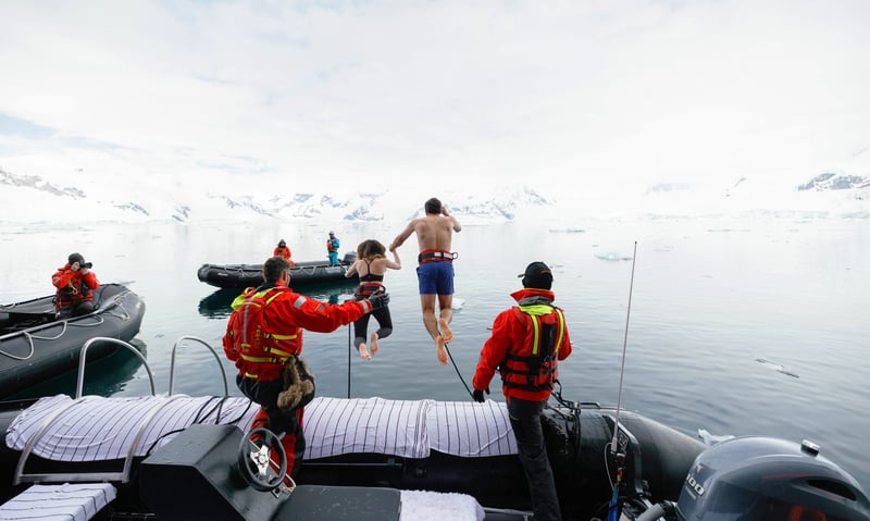 Feel the adrenaline of a polar plunge from the Seabourn ship (subject to conditions).