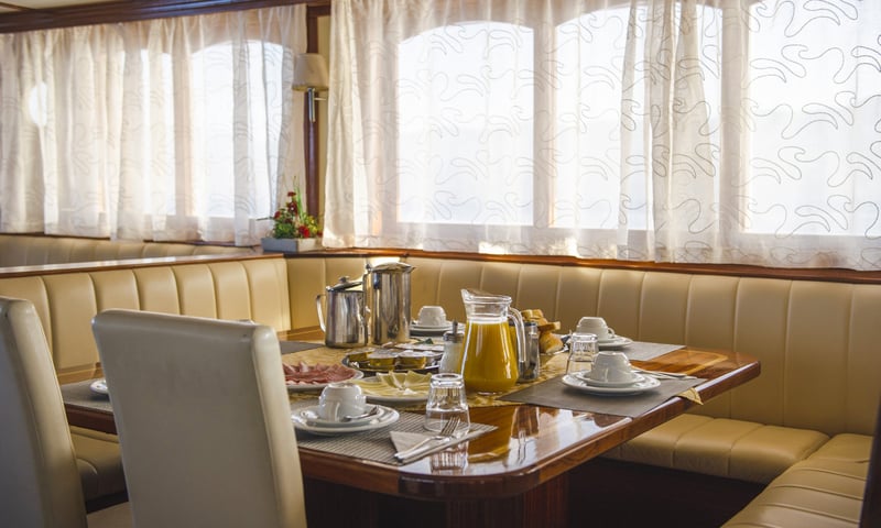 Delight in daily breakfast onboard the premium MS Amore (or similar).
