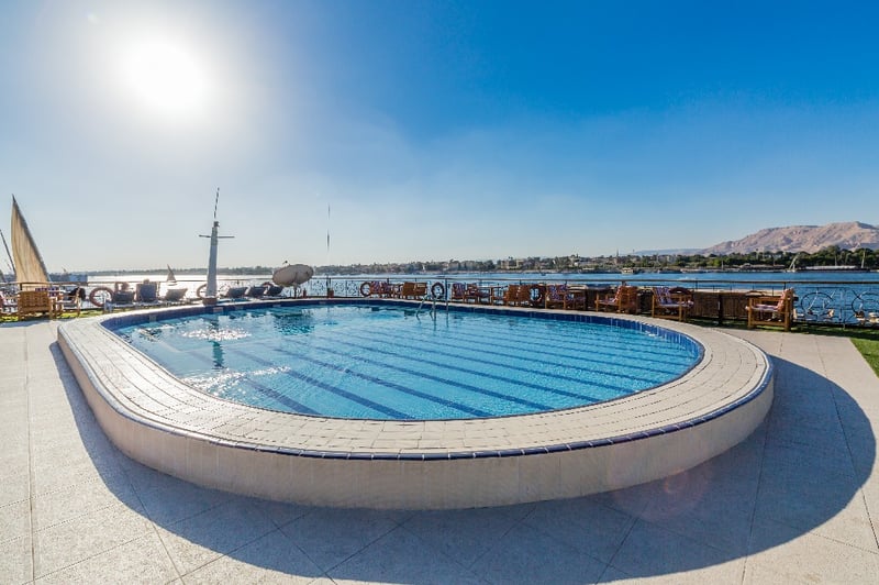 Swim in the sparkling cruise pool while you admire desert landscapes on the Nile River, Egypt