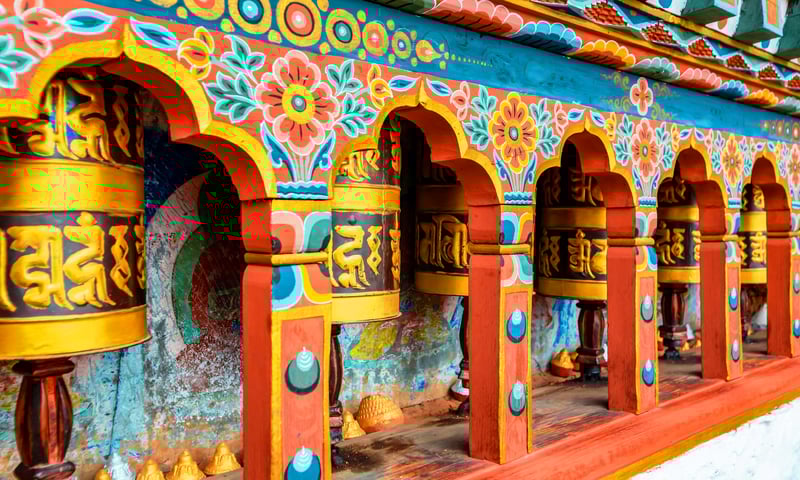Admire the colourful Bhutanese prayer wheel at Kyichu Lhakhang in Paro, Bhutan.